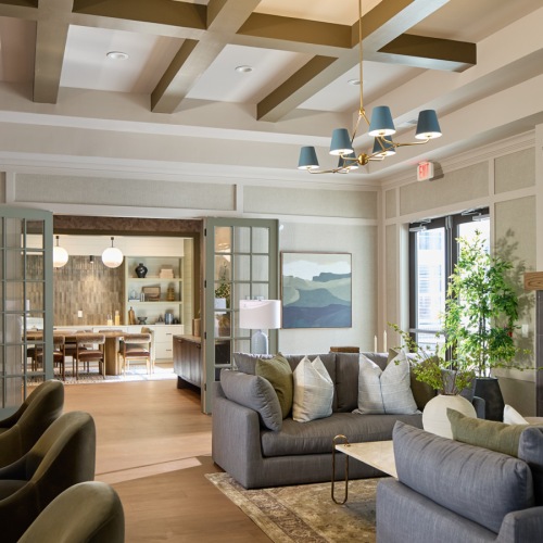 large room with couch and fireplace