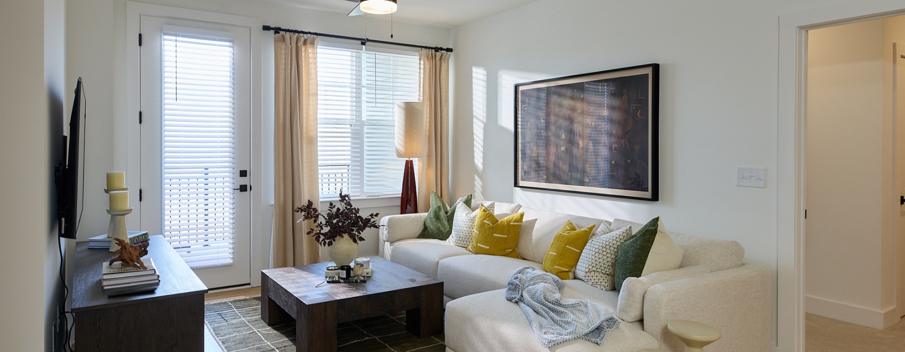a living room with a couch and a table