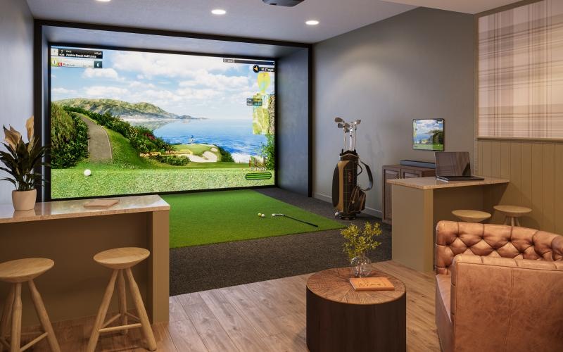 a room with a large screen and chairs